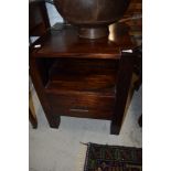 A modern hardwood bedside drawer with open shelf