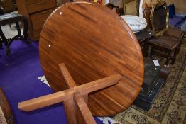 A vintage teak circular dining table on shaped legs, top in a parquet style, diameter approx. 120cm