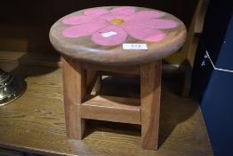 A traidtional stool with painted flower decoration