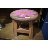 A traidtional stool with painted flower decoration