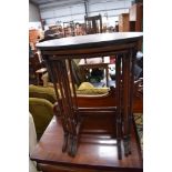 An early 20th Century mahogany nest, top table possibly having had top replaced, two undertables