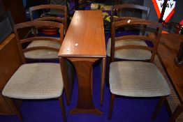 A vintage G plan or similar gateleg table and four rail back chairs, chairs labelled as G plan