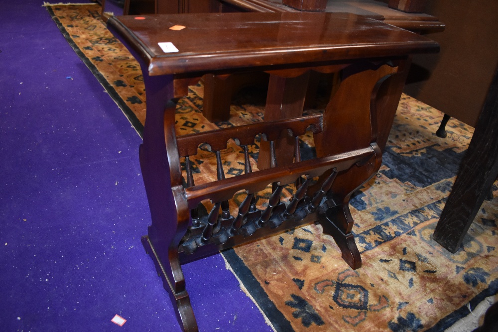 A reproduction mahogany magazine table