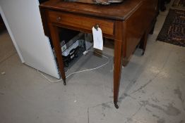 A late 19th or early 20th Century mahogany Pembroke table having frieze drawer on tapered legs and