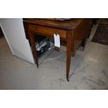 A late 19th or early 20th Century mahogany Pembroke table having frieze drawer on tapered legs and