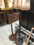 Two mahogany standard lamps