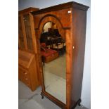 A late 19th/early 20th Century mirror door wardrobe, possibly from part of a larger set and