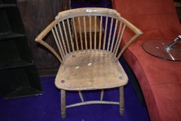 A 19th Century ash spindle back carver chair having turned and bent frame