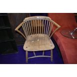 A 19th Century ash spindle back carver chair having turned and bent frame