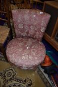 A vintage low seat nursing chair