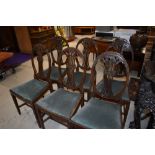 A set of six early 20th Century mahogany dining chairs, in the Hepplewhite style