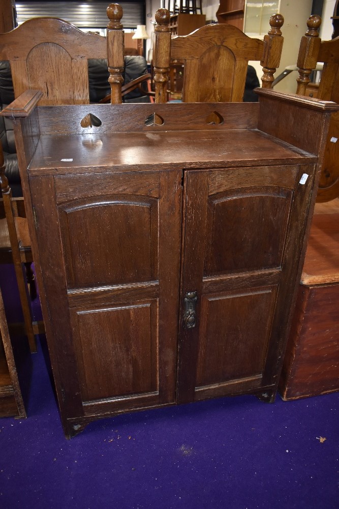 A late 19th/early 20th Century Art Nouveau oak side cabinet in the Liberty style