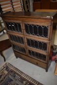 A traditional oak three tier stacking bookcase