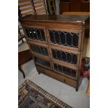 A traditional oak three tier stacking bookcase