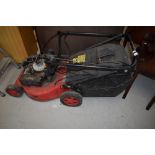 A petrol lawnmower, as found