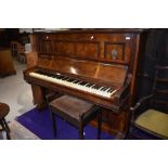 A 19th Century walnut cased upright piano , labelled for J G Irmler, Leipzig, and a stained frame