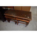 A vintage teak and tile top coffee table nest