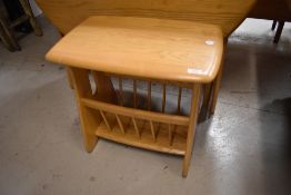 A modern light ash Ercol magazine table, 1153