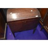 A Regency mahogany and inlaid dome top cellarette, having brass handles and tapered legs, no