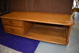 An Ercol mid colour Minerva style coffee table, width approx. 125cm