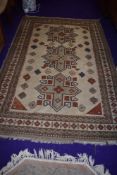 A Persian style rug, predominantly cream and russet, approx. 130 x 95cm