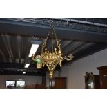An Antique cast brass candle chandelier