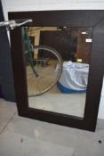 A modern leatherette wall mirror, approx. 69 x 90cm