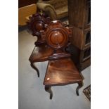 A pair of 19th Century mahogany shield back hall chairs