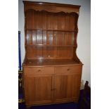 A vintage teak dresser of traditional form , shipped in by the owner from the Far East in the 1970s,