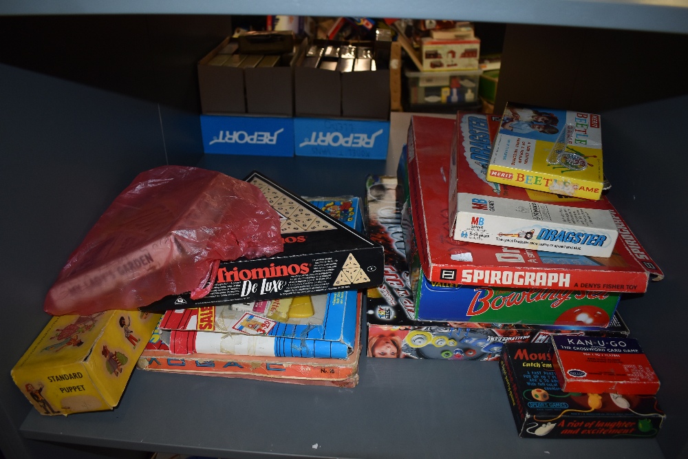 A shelf of mixed vintage Toys & Games including a Pelham Puppet Standard Puppet Heidi, boxed,