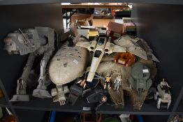 A shelf of 1980's and later Kenner, LFL and similar Star Wars vehicles and figures including AT-