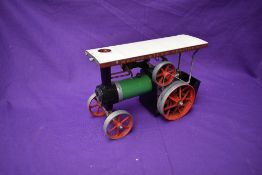 A Mamod Live Steam Tractor TE1A in green and black with white roof