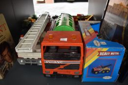 A Tonka Toys pressed steel Fire Engine, a Bruder plastic Recycling Wagon and a Remco pressed steel