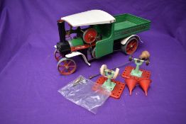 A Mamod Live Steam Wagon SW1 in green with white cab roof along with two accessories and two