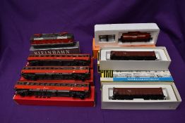A Kleinbahn HO scale Locomotive 1044 209-3 and three Wagons, all boxed along with a Piko HO scale