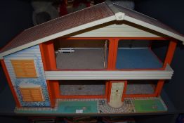 A 1970's wooden and plastic two story My First Home Doll's House