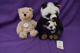 Three modern Steiff Bears, Cha Cha Panda and Cub, having yellow tag and button in ear numbered