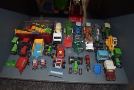 A collection of Britains and similar diecast and plastic playworn agricultural vehicles,