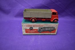 A Dinky Supertoys diecast, Guy 4 Ton Lorry having grey body, red cab and chassis, in original box