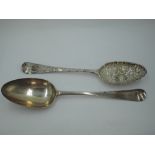 A Georgian silver berry spoon having frilled rim to bowl and later chased stem, London 1749,