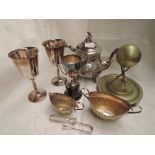 A small selection of silver plate including a teapot, goblets, rifle shooting trophy, sugar bowls
