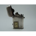 A Swiss white metal 1920's Thorens Brevete lighter no:81816 having engine turned decoration to