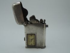 A Swiss white metal 1920's Thorens Brevete lighter no:81816 having engine turned decoration to