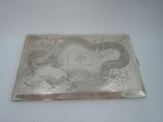 A Chinese silver cigarette case of rectangular form having engraved dragon decoration to front