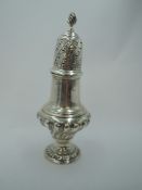 An Edwardian silver sugar caster of baluster form having moulded decoration to body, and pierced