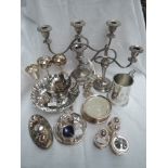 A selection of silver plated items including goblets, candelabrum, cruet sets, bird study etc