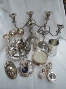 A selection of silver plated items including goblets, candelabrum, cruet sets, bird study etc