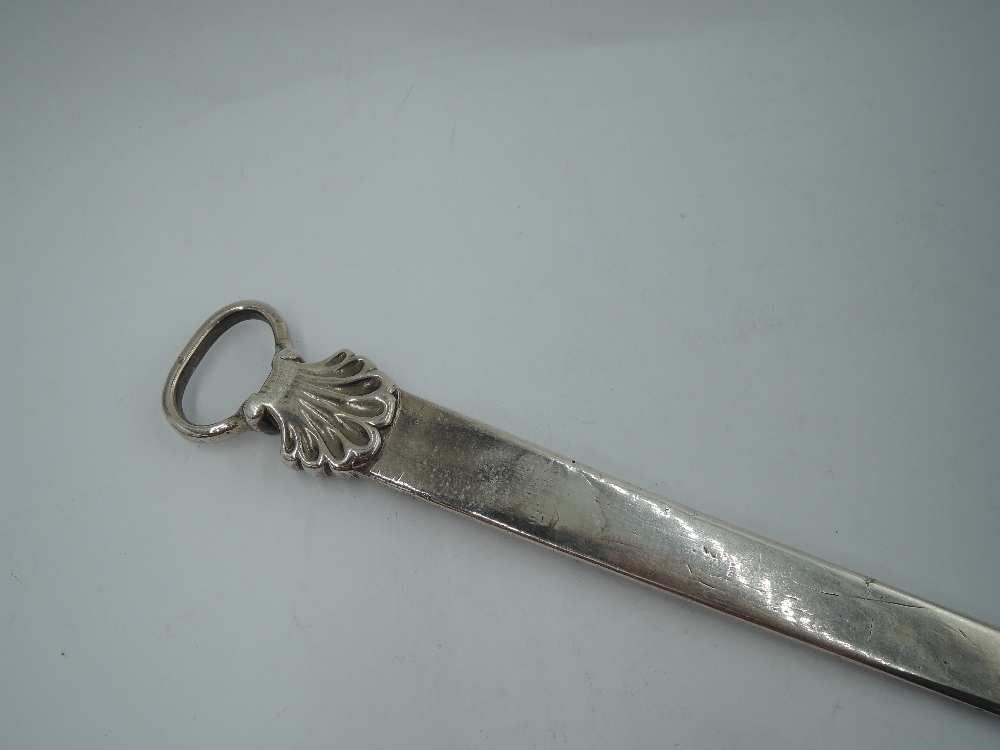 A Georgian silver meat skewer of traditional form having scallop decoration to loop handle,