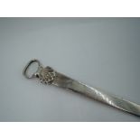 A Georgian silver meat skewer of traditional form having scallop decoration to loop handle,