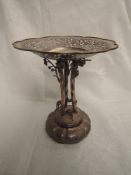 A late 19th/early 20th Century Chinese silver table comport having three moulded Cranes on an